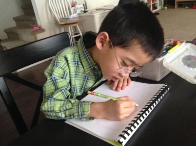 Both boys wore their glasses all day - even when doing their homework before school